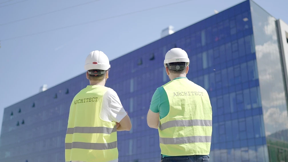 Architects conducting design supervision on a construction site