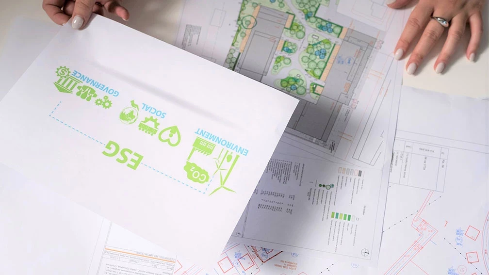 ESG documentation placed over architectural and landscape plans