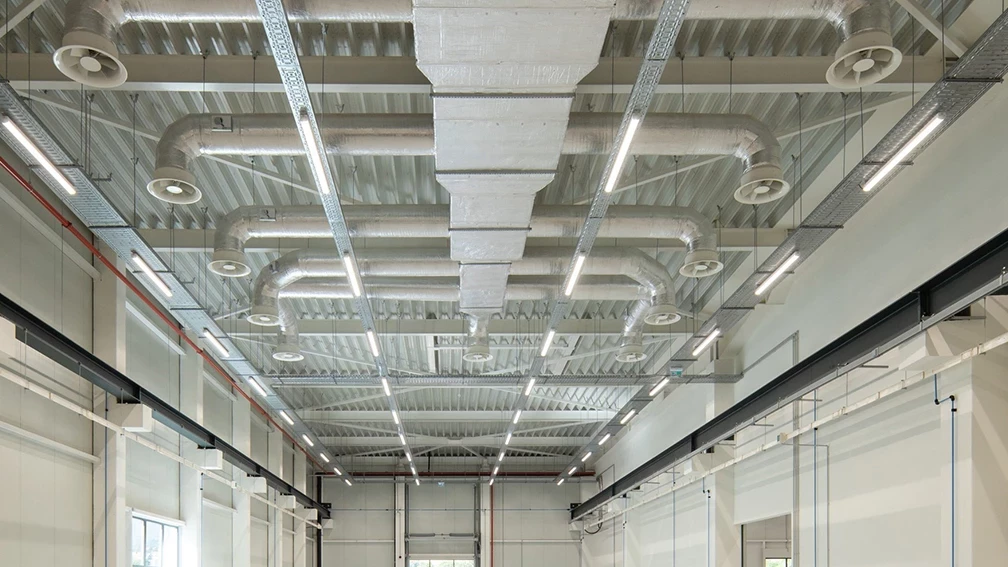 Ventilation ducts and ceiling diffusers in an industrial building