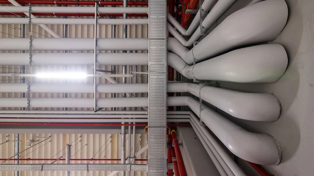Water supply and sewerage pipework below the ceiling of an industrial building