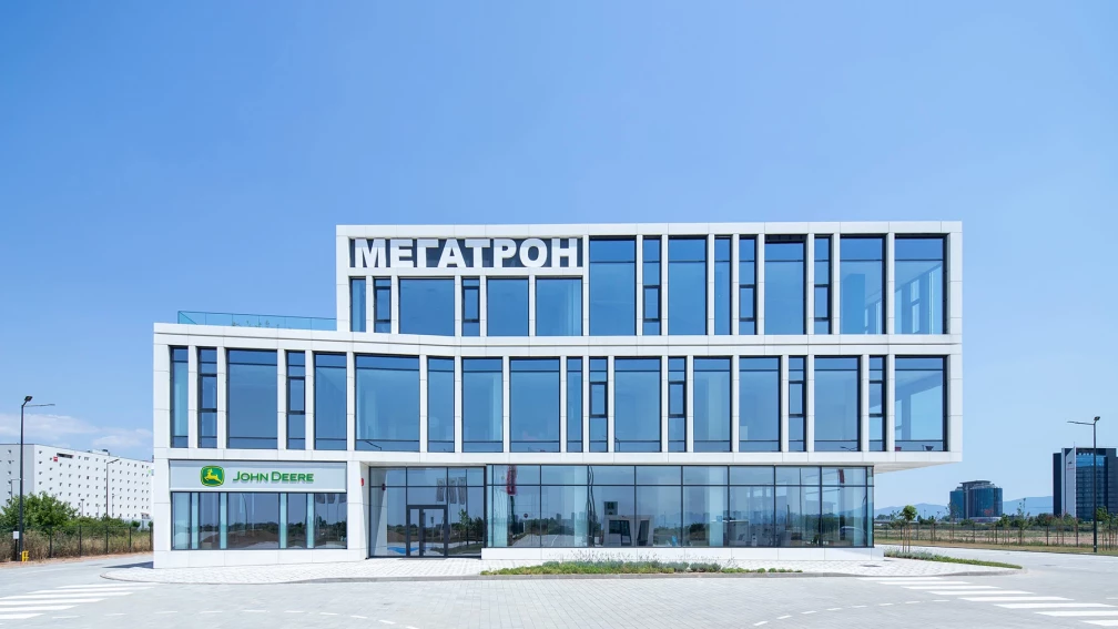 Фронтален изглед към централния офис на Megatron в София с остъклена офис фасада и сервизна сграда