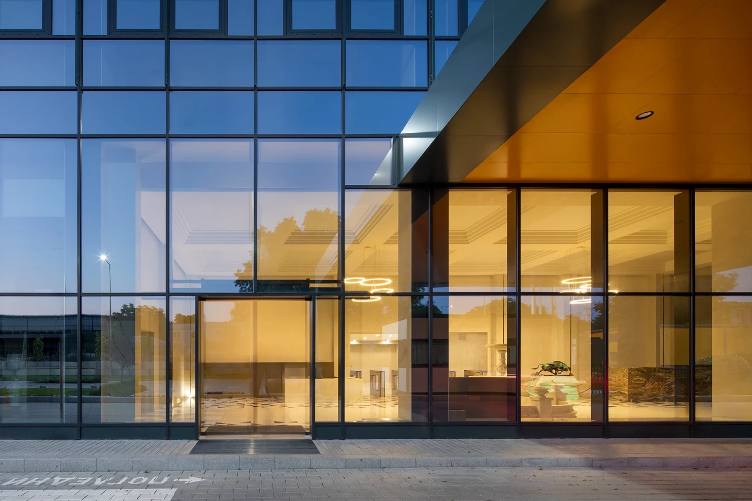 Glazed main entrance of the AREON administrative building in Varna