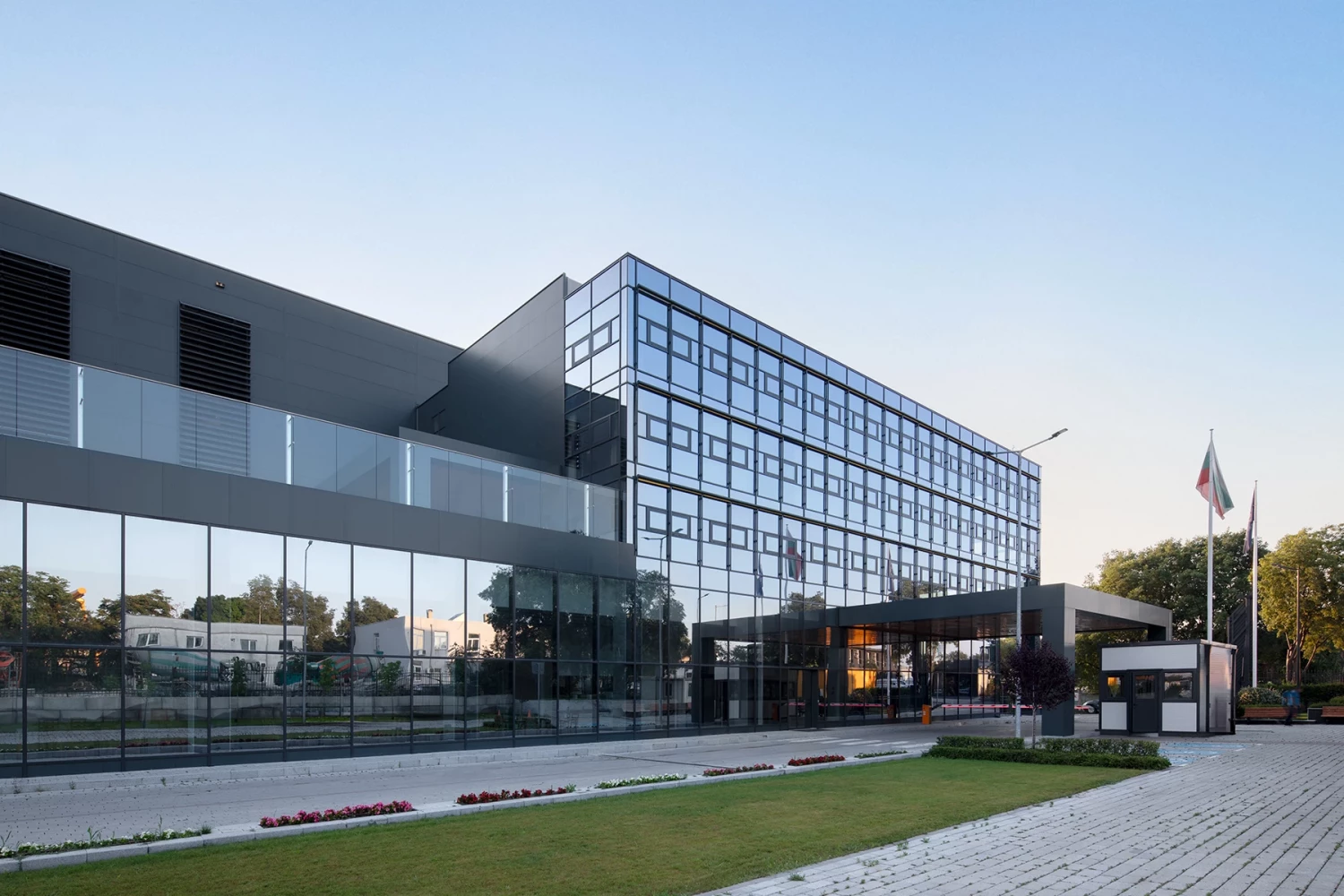 Exterior view of the administrative building and entrance area at the AREON complex