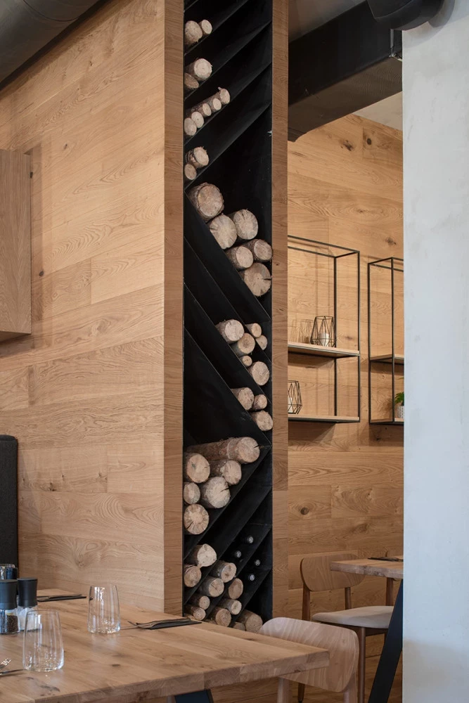 Interior detail at Bella Vista with wood cladding and integrated firewood storage