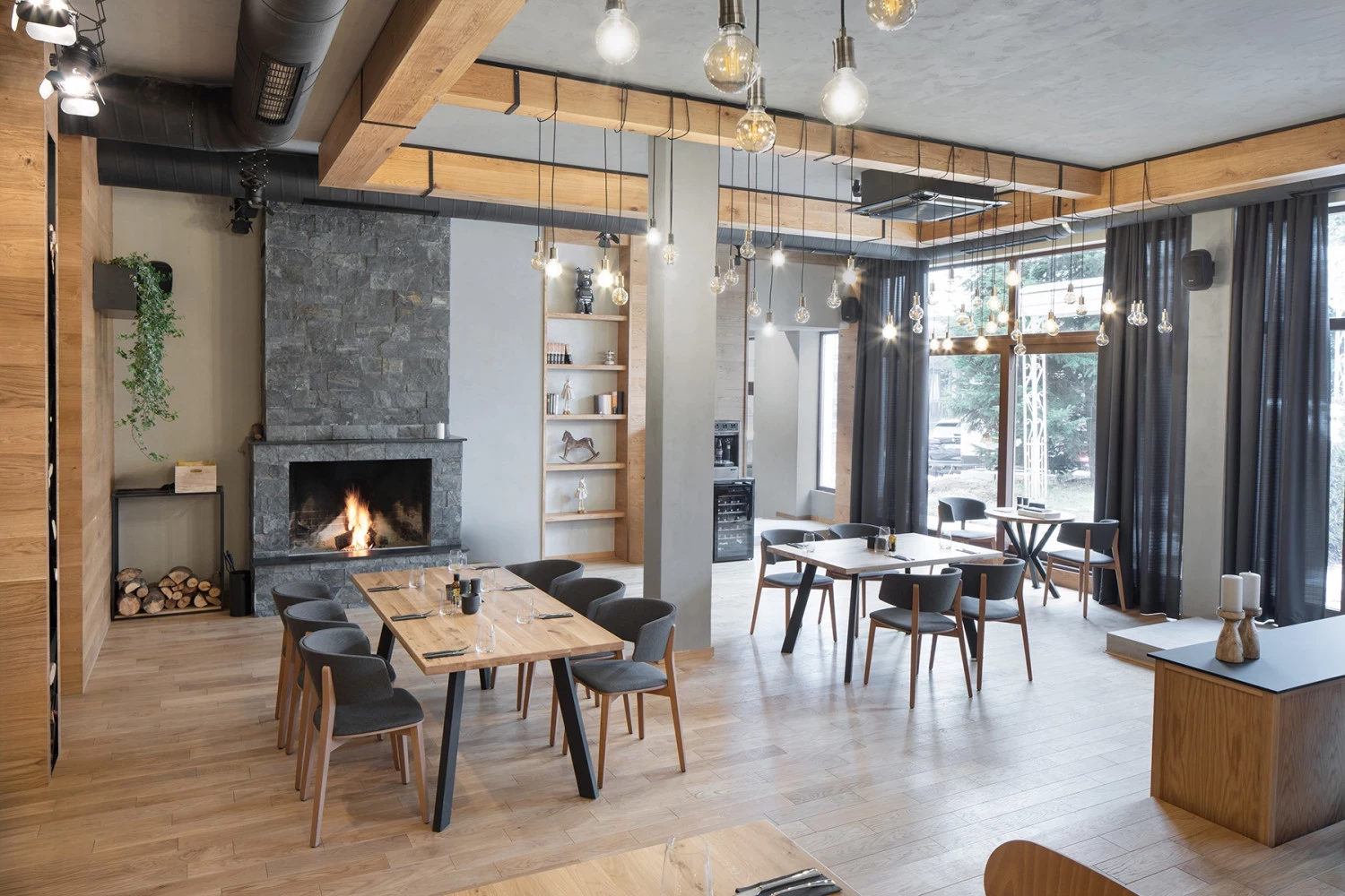 Main dining area of Bella Vista restaurant with fireplace and seating