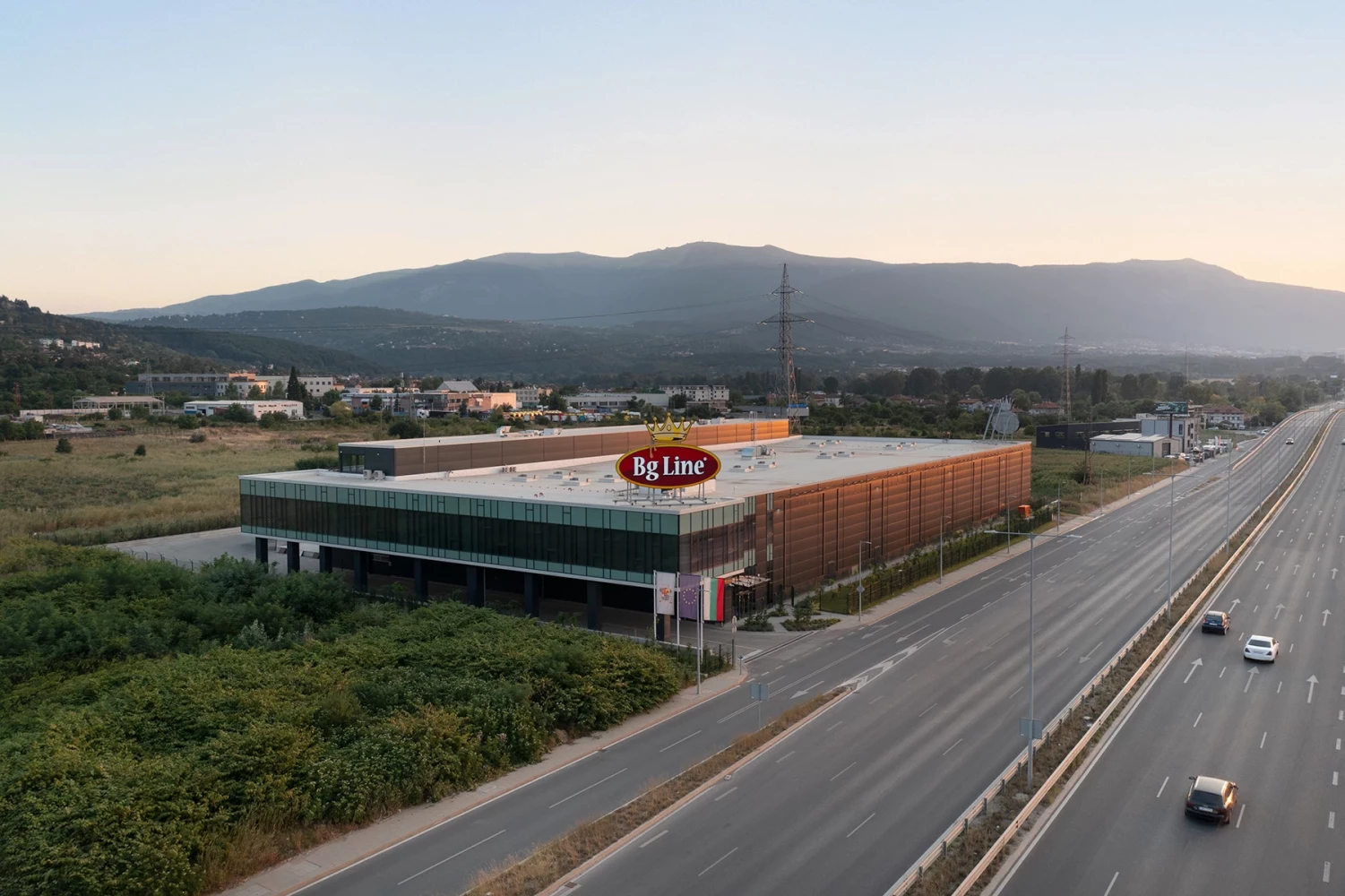 Aerial view of BG Line Logistics Base, warehouse building, and main road access