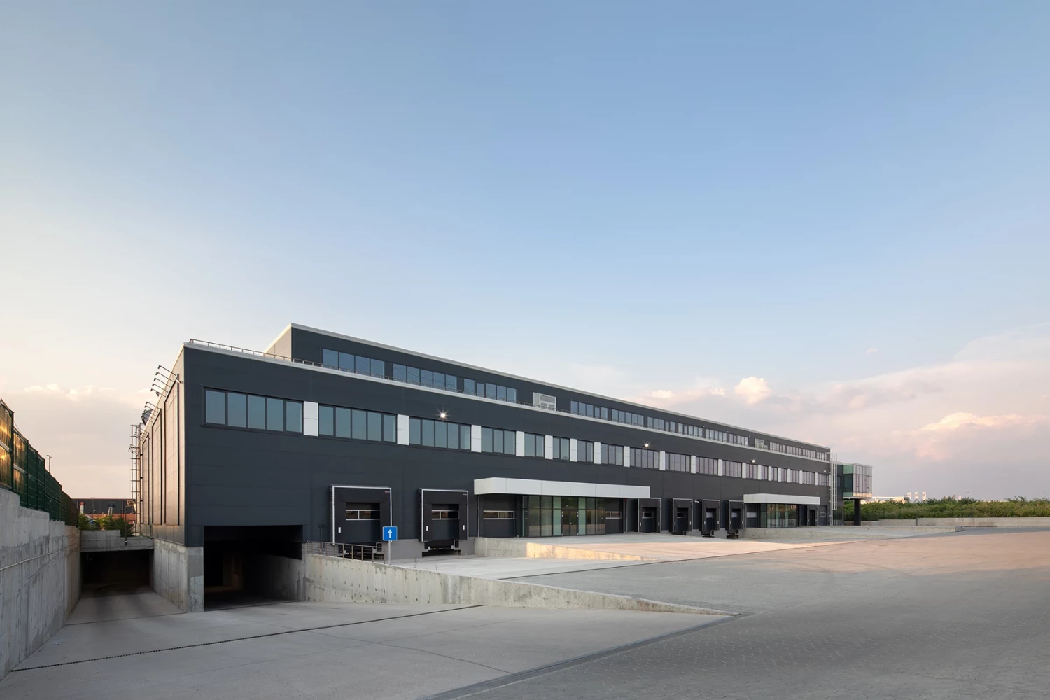 General view of the warehouse building and loading area at BG Line Logistics Base
