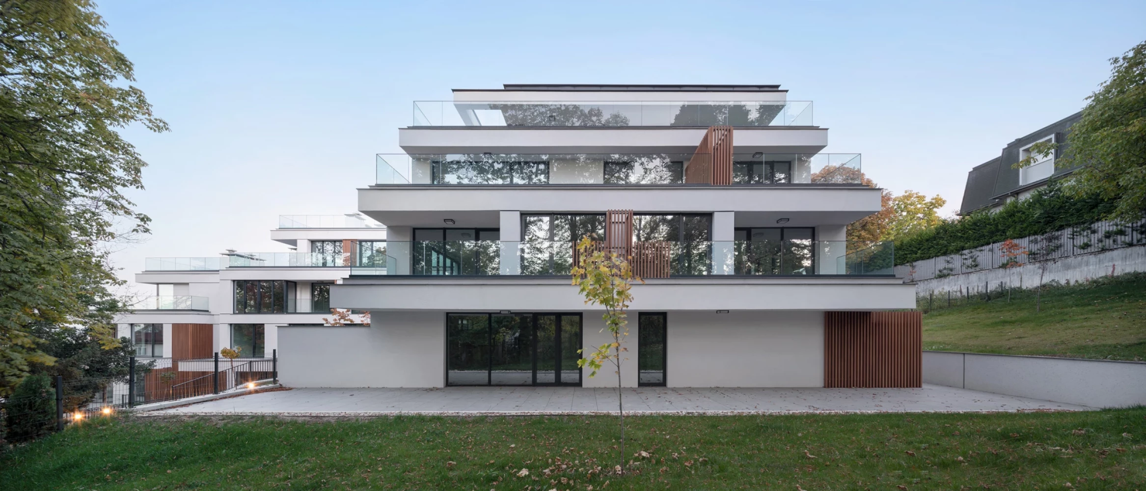 Terraced section of Boyana Senses with landscaped space in front of the building