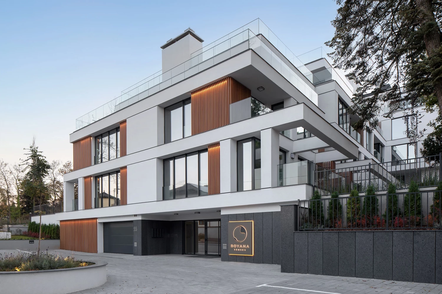 Corner facade of Boyana Senses with large windows and wood elements