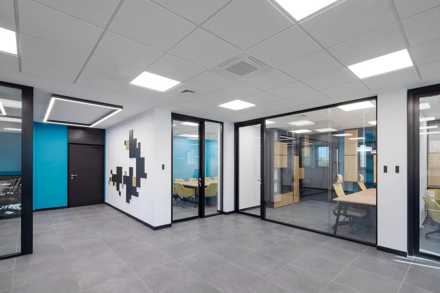 Office interior in the CSC building with glazed partitions and workspaces