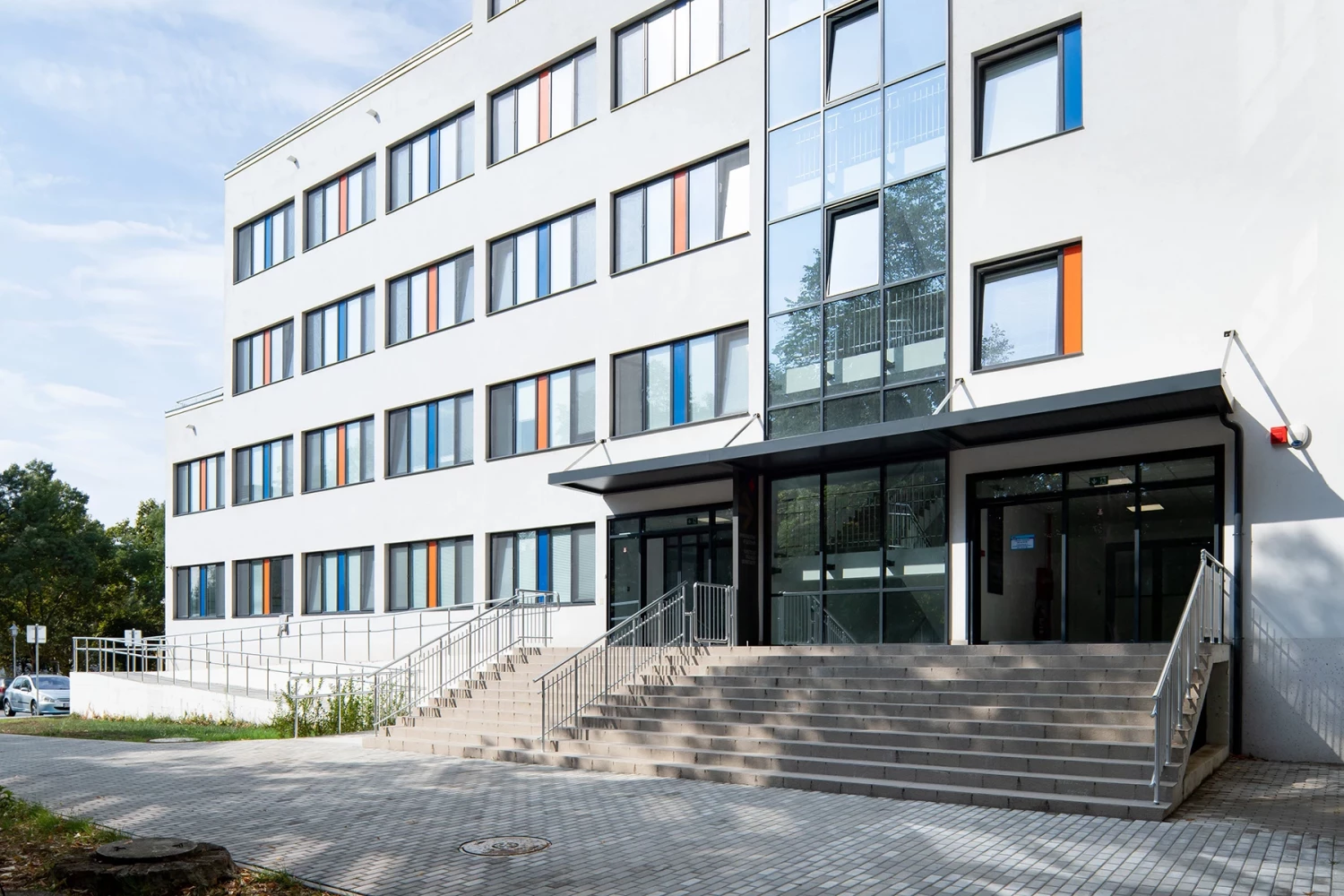 Main entrance to the new wing of Dr. Stefan Cherkezov Hospital with stairs and covered entrance