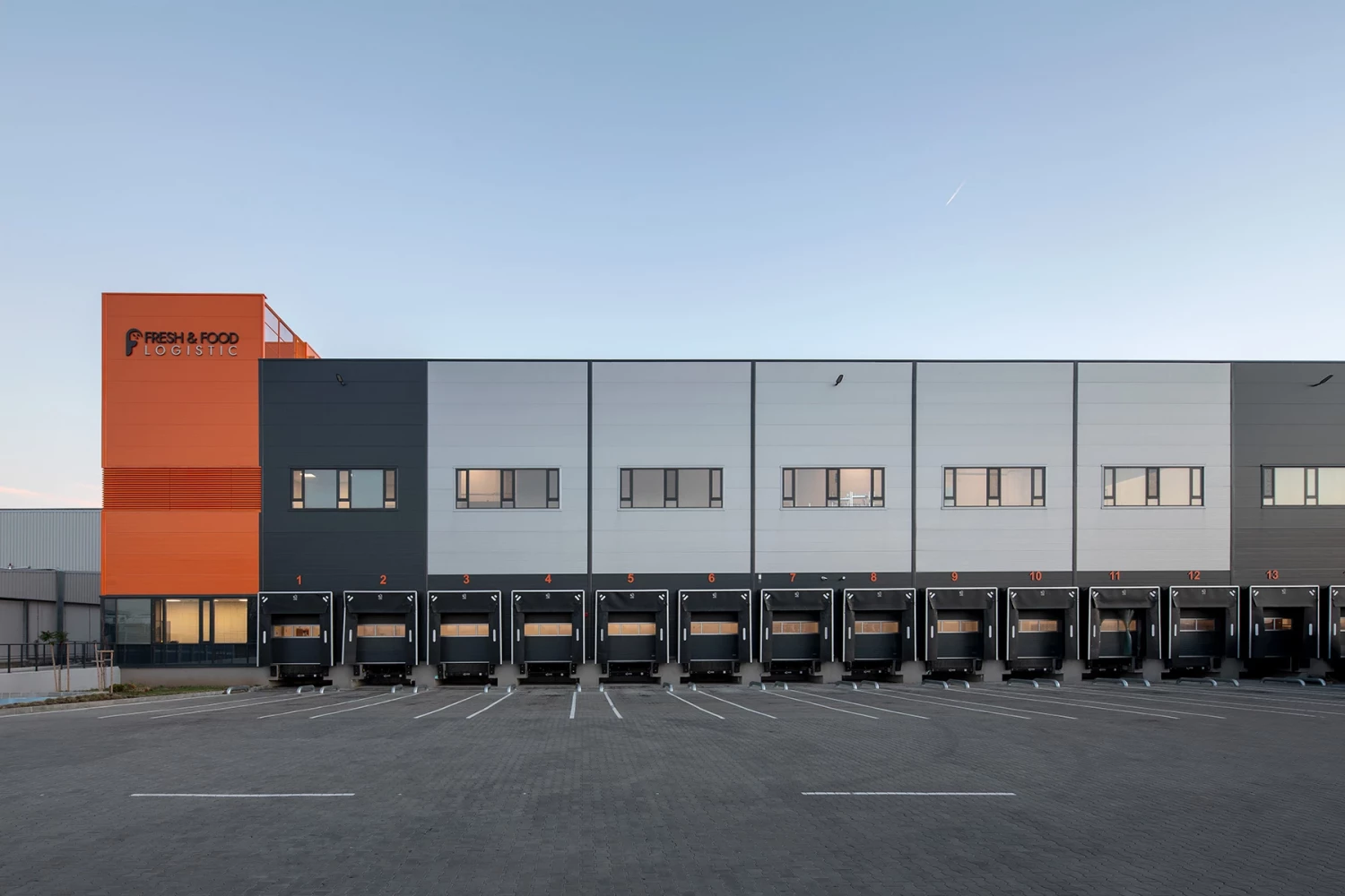 Front view of the Fresh&Frozen warehouse facility with loading docks