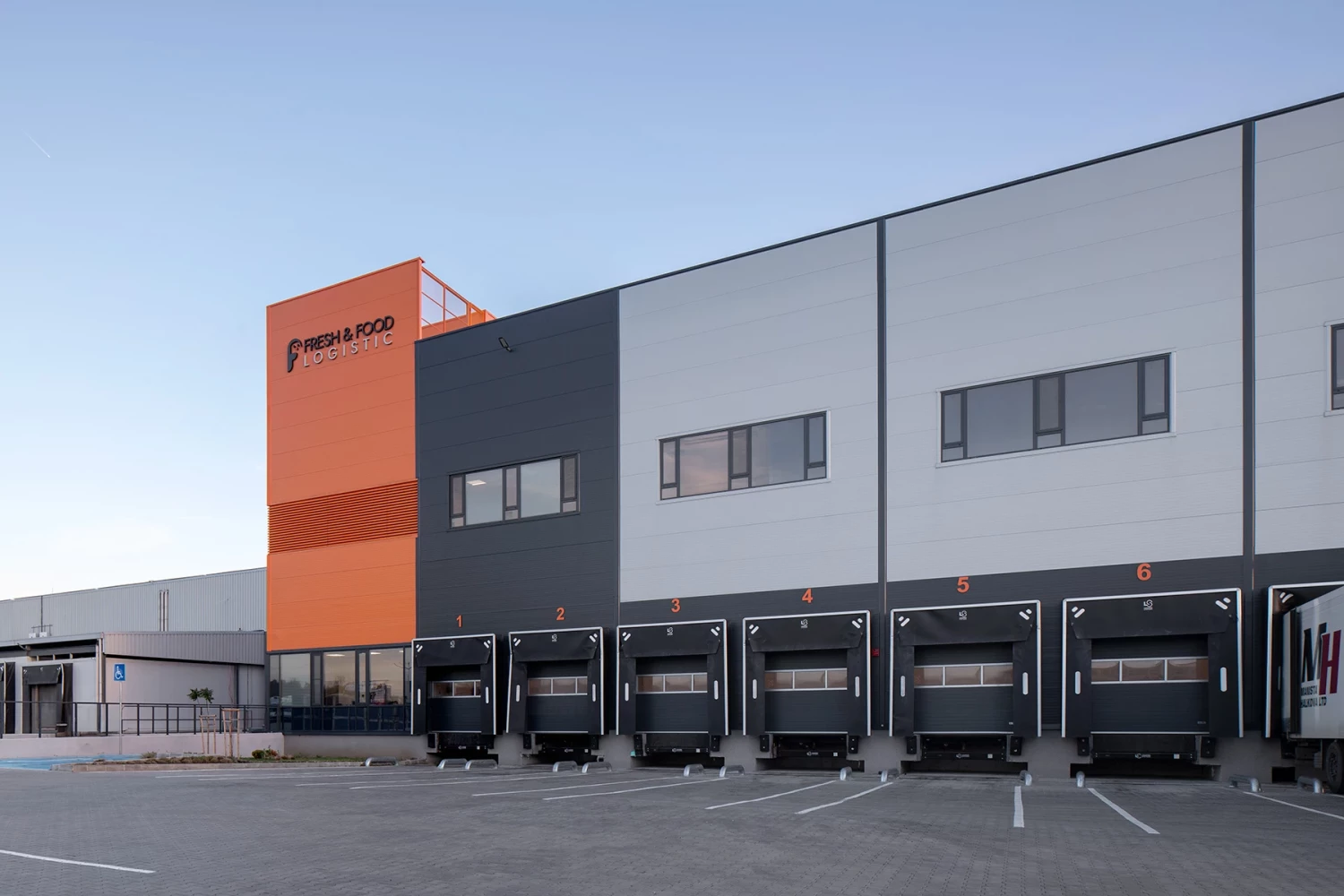 Perspective view of the Fresh&Frozen logistics facility and truck loading area