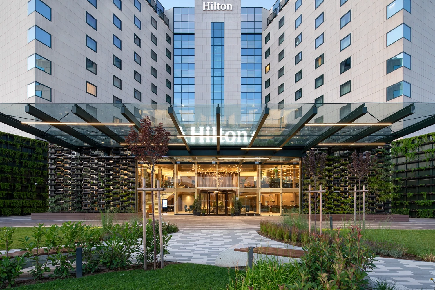 Main entrance of Hilton Sofia with the new glazed canopy and vertical greenery