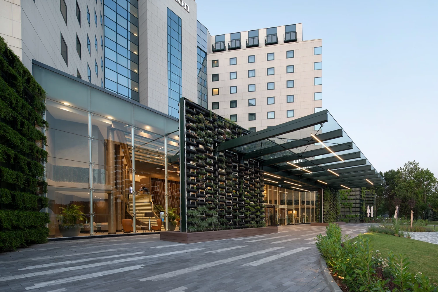 Side view of the new entrance canopy at Hilton Sofia and the green facade