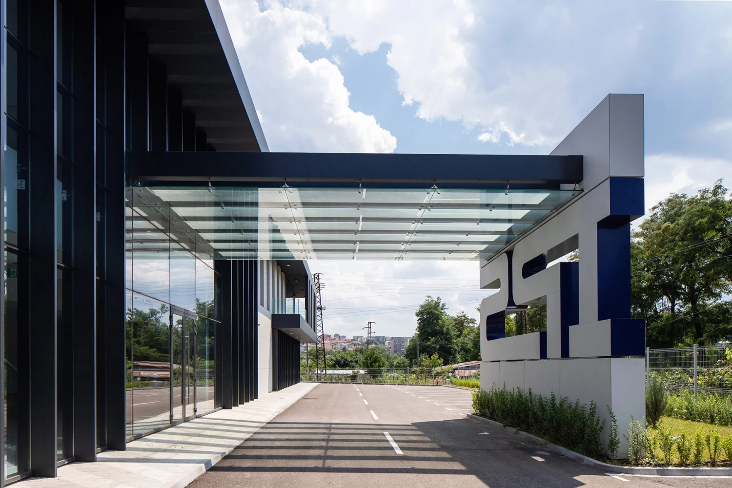 Entrance area of the IPS Production Complex with covered vehicle access and canopy