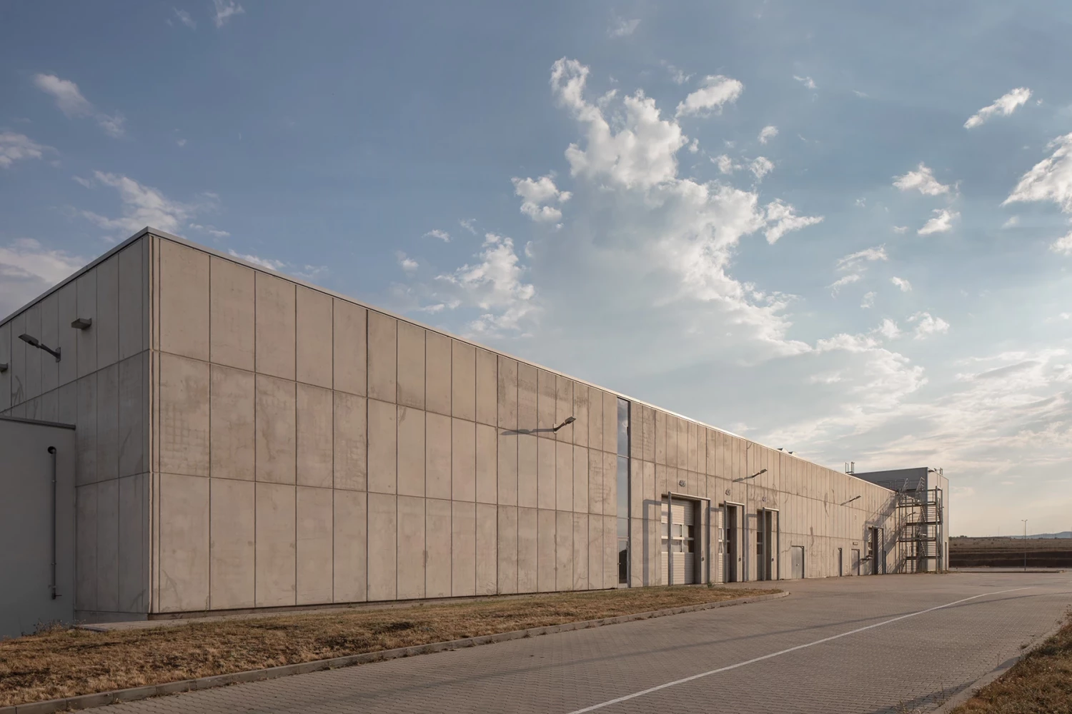 Side facade of a warehouse building at the JYSK Logistics Base
