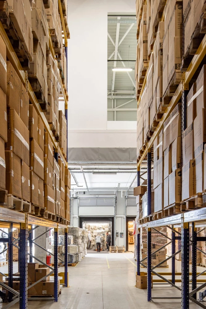 Warehouse aisle between high-bay racking systems at Office 1 Block C