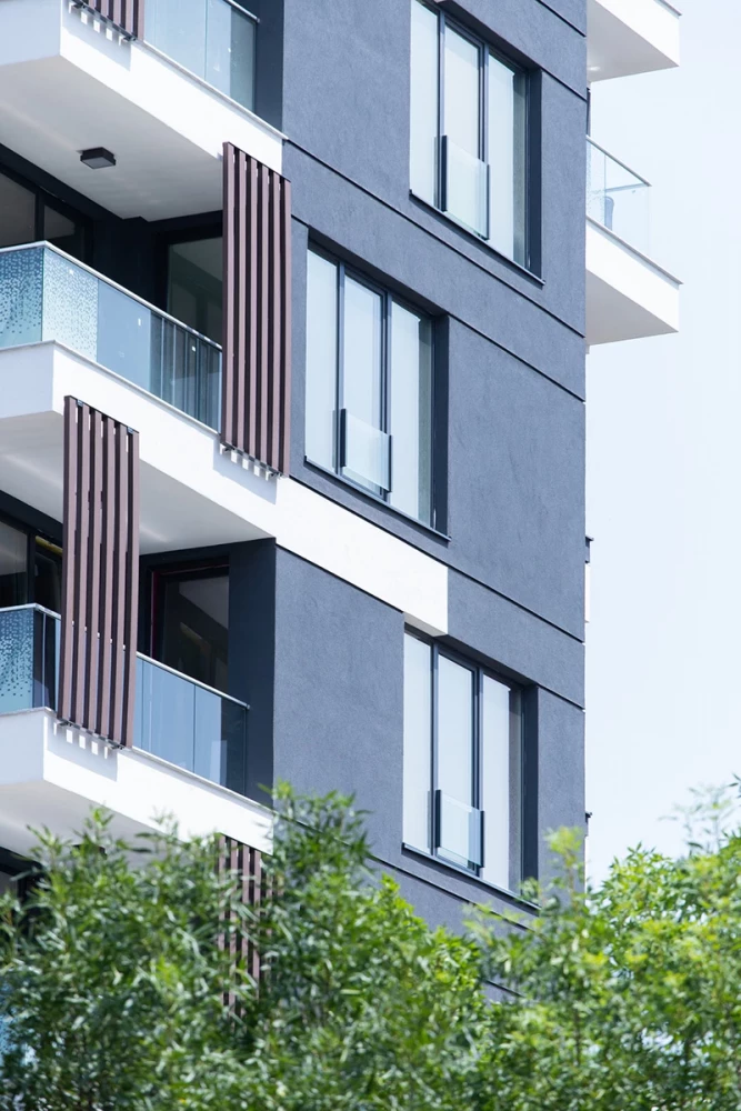 Park View Residence facade detail with dark cladding and vertical wood screens