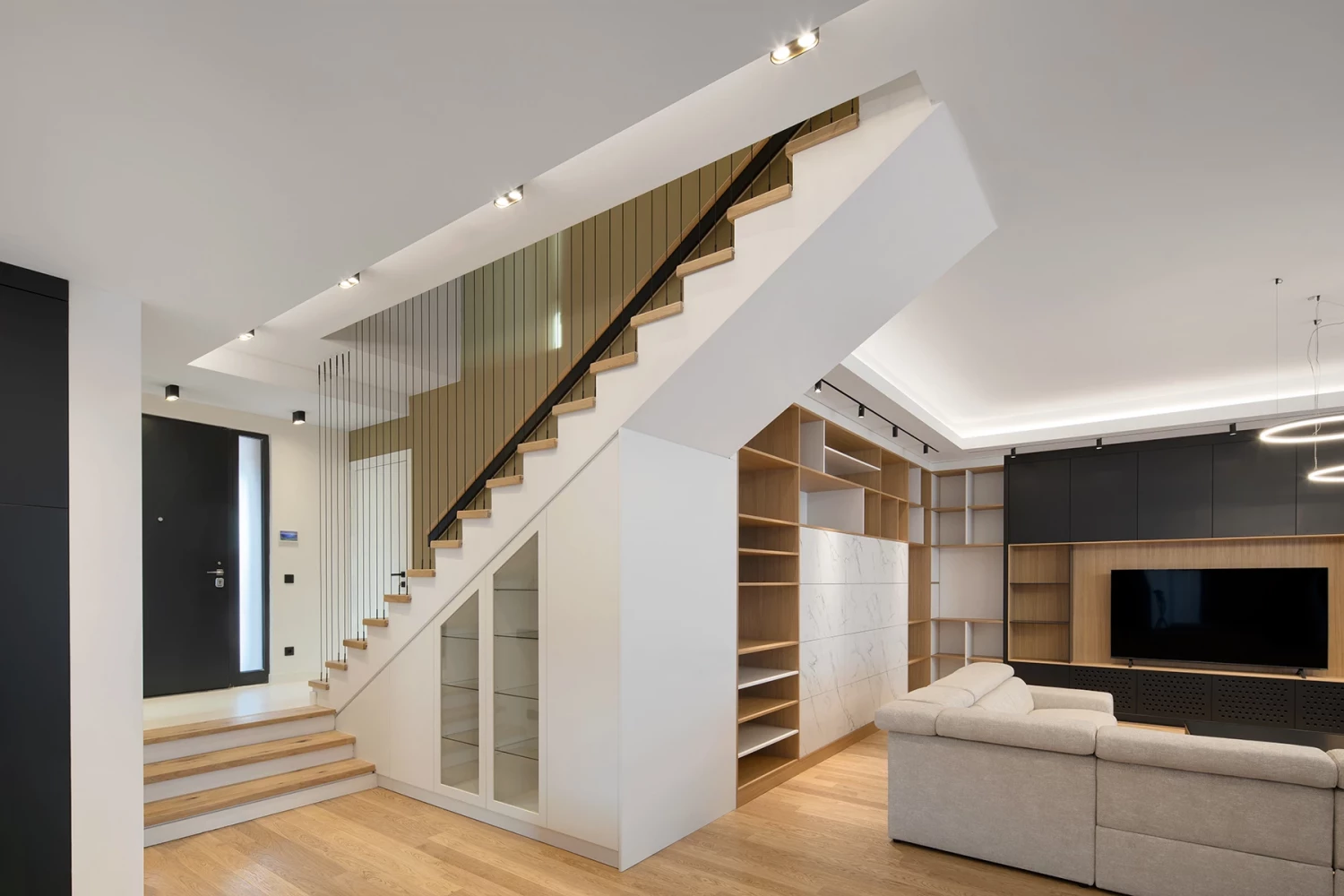 Interior staircase in the SPV house with an open steel cable railing