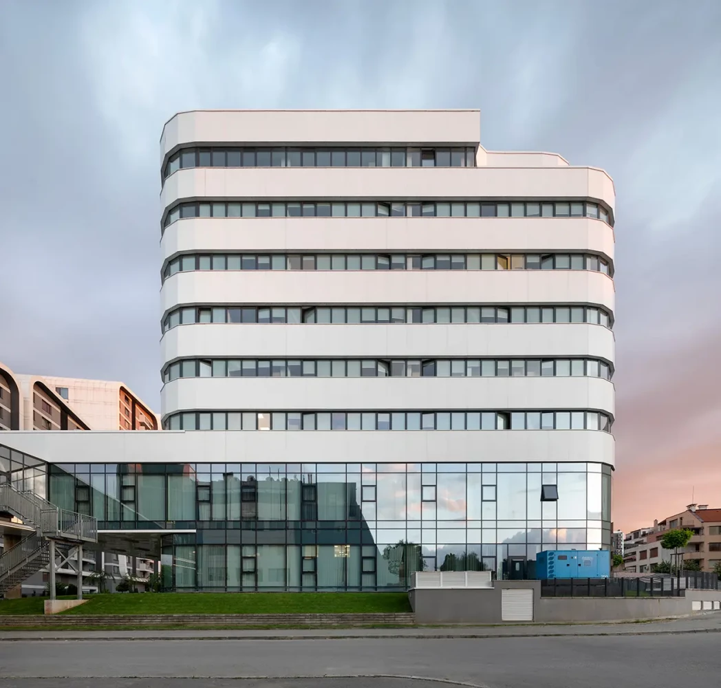 Main facade of the new St. Sofia General Hospital wing with a glazed ground floor by IPA - Architecture and more