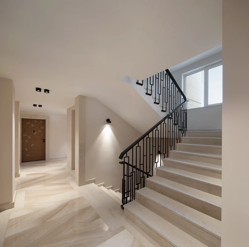 Interior of the common areas and staircase at the Sunset Garden residential building