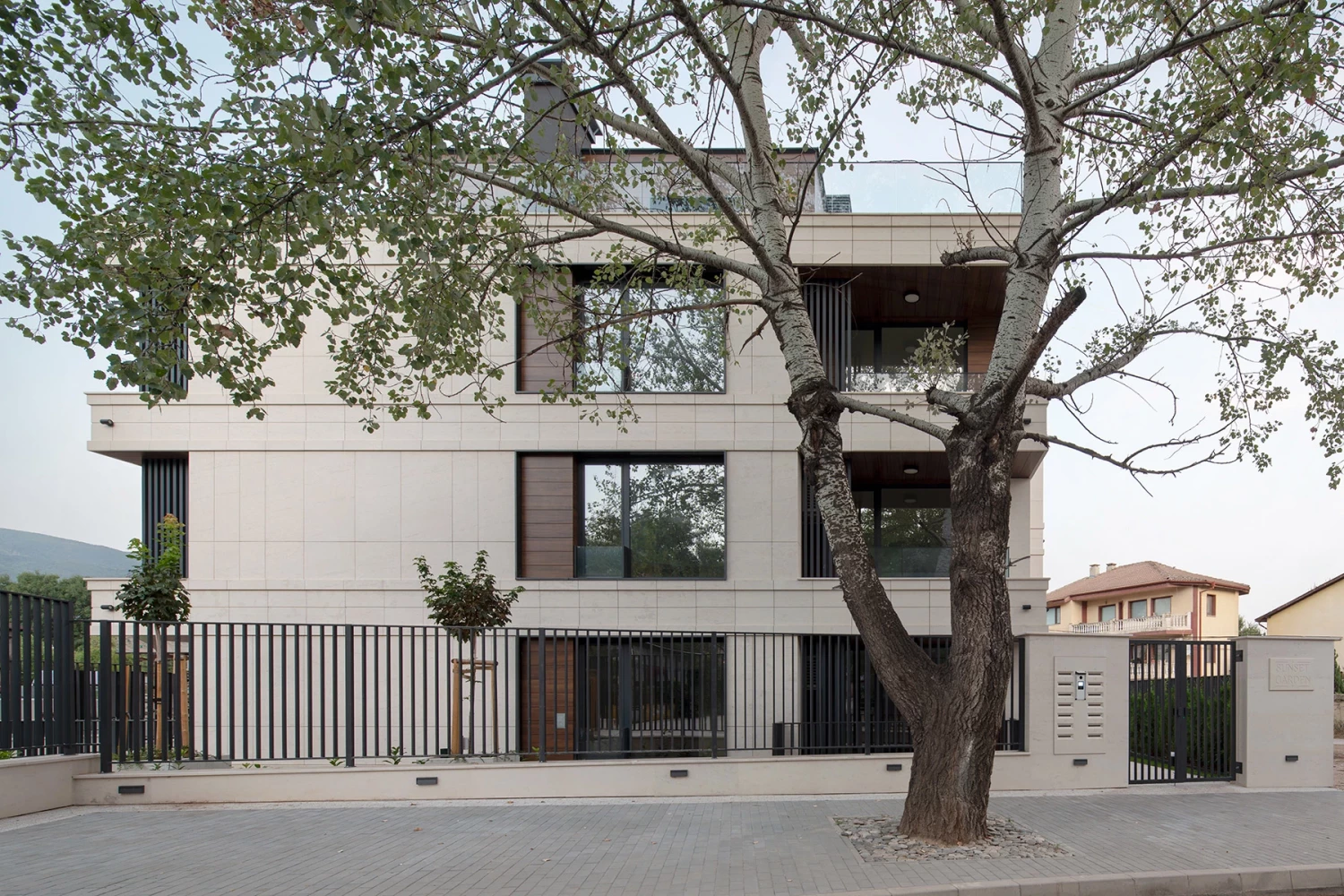 Side facade and entrance of the Sunset Garden residential building