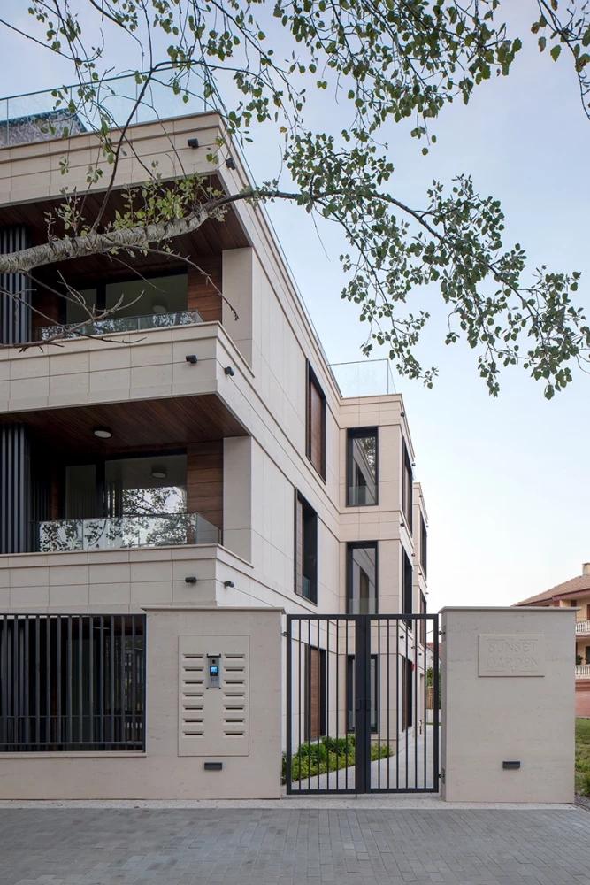 Detail of the balconies and stone facade of the Sunset Garden residential building