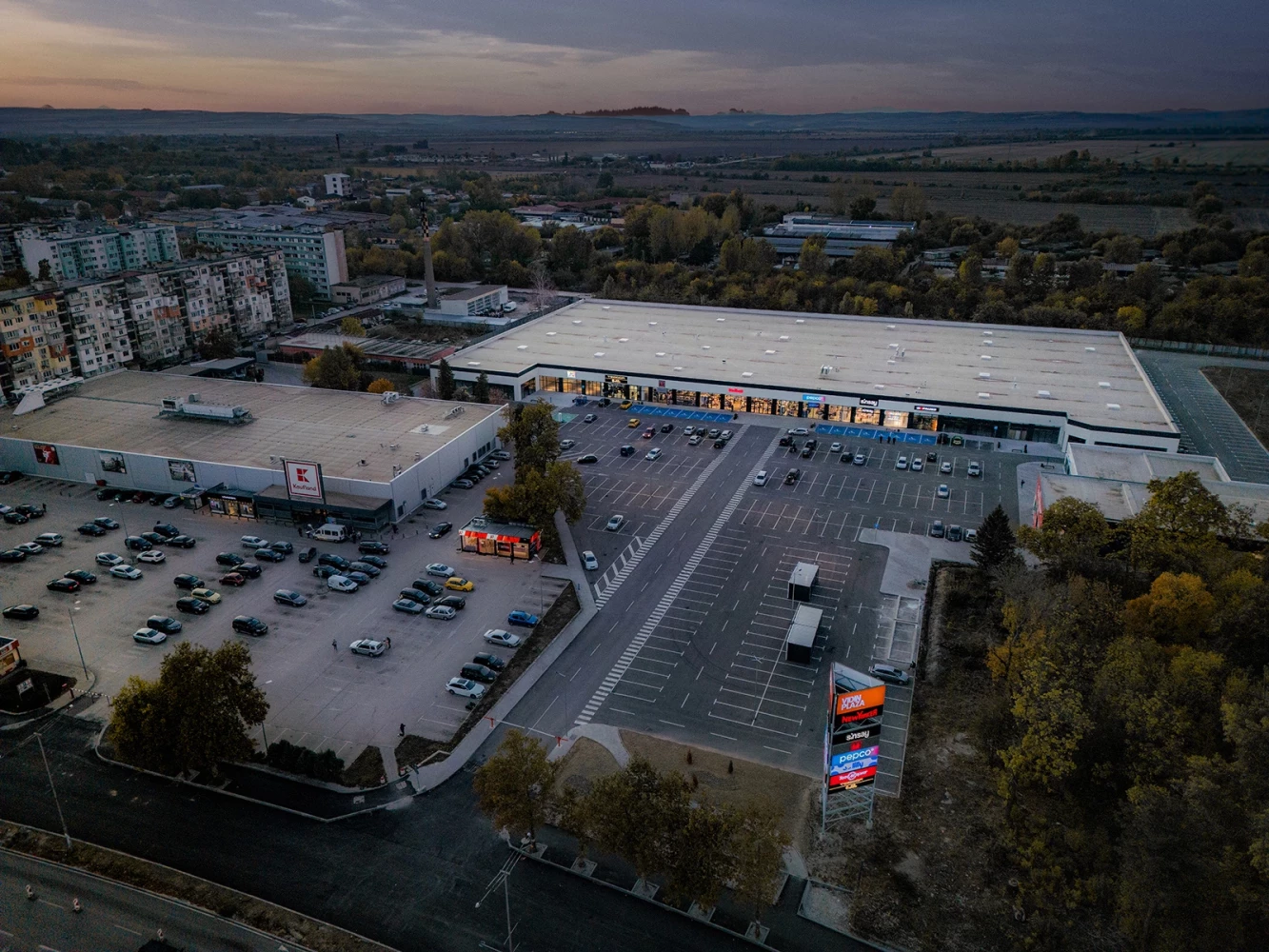 Aerial view of the entrance, parking area, and retail buildings at Vidin Plaza