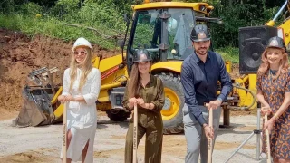 Participants at the Boyana Senses groundbreaking ceremony in front of construction equipment