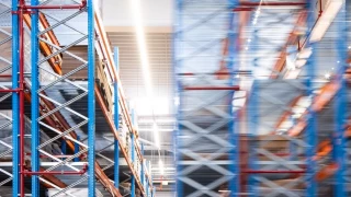 High-bay warehouse with industrial steel structures and storage systems