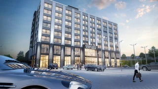 Evening visualization of Veliko Tarnovo Business Center with illuminated facades and ground-floor spaces