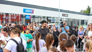 Visitors in front of the retail facades at Vidin Plaza