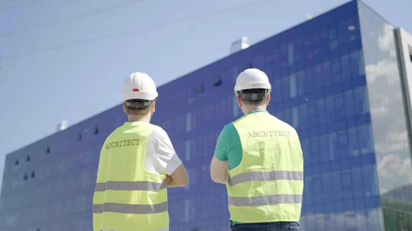 Architects conducting design supervision on a construction site