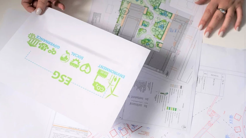 ESG documentation placed over architectural and landscape plans