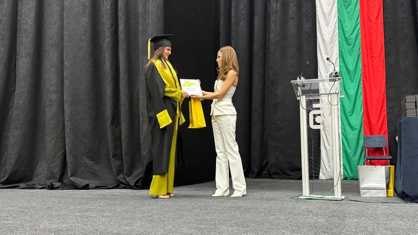 IPA representative presenting a certificate to a UACEG architecture graduate